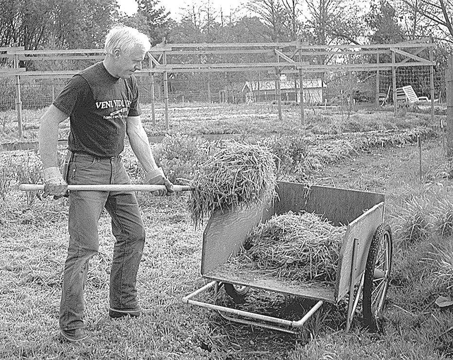 Bob Gregson throwing hay 10 keys to small farm success