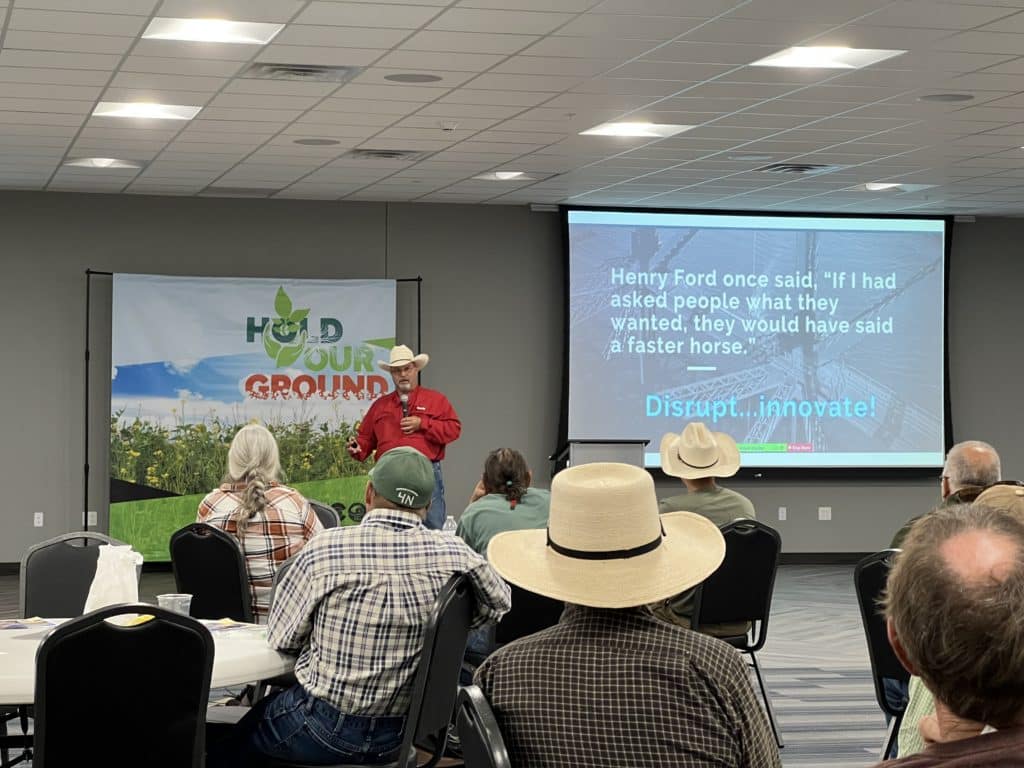 Oklahoma farmer Jimmy Emmons presents to the audience.